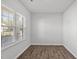 Bedroom with wood floor, neutral paint and a window with blinds providing lots of natural light at 147 Young Farm Dr, Lillington, NC 27546