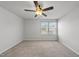 Neutral bedroom featuring carpet floors, ceiling fan and window at 147 Young Farm Dr, Lillington, NC 27546