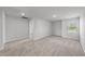 Large bonus room featuring neutral carpeting, recessed lighting and a window for natural light at 147 Young Farm Dr, Lillington, NC 27546