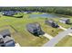 Charming two-story home with a spacious yard and a serene pond view, fenced backyard, and a long driveway at 147 Young Farm Dr, Lillington, NC 27546