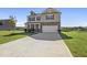 Charming two-story home featuring a welcoming front porch and attached two-car garage at 147 Young Farm Dr, Lillington, NC 27546