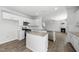 Kitchen with island, stainless steel appliances, granite countertops and view to the living room at 147 Young Farm Dr, Lillington, NC 27546