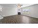 Spacious living room with hardwood floors, fireplace and a ceiling fan for comfortable living at 147 Young Farm Dr, Lillington, NC 27546