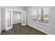Office featuring wood floors, neutral paint, French doors, and a window with blinds at 147 Young Farm Dr, Lillington, NC 27546