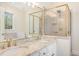 Bright bathroom with double sinks and a tiled shower at 1532 Rockwood Downs Dr, Wendell, NC 27591