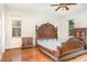 Spacious bedroom with hardwood floors and a large bed at 1532 Rockwood Downs Dr, Wendell, NC 27591