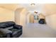 Spacious bonus room features neutral carpet, natural light, and a ceiling fan at 1532 Rockwood Downs Dr, Wendell, NC 27591