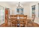 Elegant dining room with hardwood floors and a classic chandelier at 1532 Rockwood Downs Dr, Wendell, NC 27591