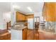 Well-lit kitchen featuring wooden cabinets, granite countertops, and stainless steel appliances at 1532 Rockwood Downs Dr, Wendell, NC 27591