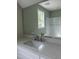 Well lit bathroom with a white quartz countertop and stainless steel faucet at 162 Kirkwall Ln, Selma, NC 27576