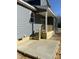New construction home featuring a concrete patio and covered wood deck at 162 Kirkwall Ln, Selma, NC 27576