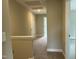 A well-lit hallway with neutral carpet and paint, connecting various rooms in the home and offering a seamless transition at 162 Kirkwall Ln, Selma, NC 27576