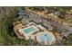 A stunning aerial view captures the community pool, splashpad, clubhouse, and well-manicured grounds at 1637 Hasentree Villa Ln, Wake Forest, NC 27587