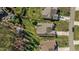 Aerial view of a home featuring a backyard with a shade canopy and mature trees at 1637 Hasentree Villa Ln, Wake Forest, NC 27587