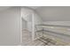 Efficient attic storage solution with wire shelves, maximizing space within the home at 1637 Hasentree Villa Ln, Wake Forest, NC 27587