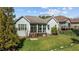 Charming backyard showcasing a screened-in porch and lush green lawn at 1637 Hasentree Villa Ln, Wake Forest, NC 27587