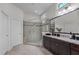 Luxurious bathroom with tiled walk-in shower, granite countertop, and stylish vanity, creating a spa-like retreat at 1637 Hasentree Villa Ln, Wake Forest, NC 27587