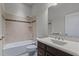 Clean bathroom featuring a combined tub and shower, neutral tile, and a vanity with great storage at 1637 Hasentree Villa Ln, Wake Forest, NC 27587