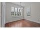Bright breakfast nook with plantation shutters and modern lighting offers a serene space for meals at 1637 Hasentree Villa Ln, Wake Forest, NC 27587