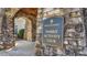 Entrance to the Hasentree Gathering Activity Club with stone archway and manicured landscaping at 1637 Hasentree Villa Ln, Wake Forest, NC 27587