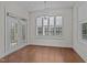 Bright dining area with hardwood floors, large windows and glass doors allowing for a seamless flow of natural light at 1637 Hasentree Villa Ln, Wake Forest, NC 27587