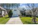 Charming two-story home featuring a well-manicured lawn, attached two-car garage, and lovely landscaping at 1637 Hasentree Villa Ln, Wake Forest, NC 27587