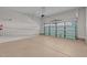 Spacious garage with an automatic door, featuring speckled flooring and ample room for vehicles and storage at 1637 Hasentree Villa Ln, Wake Forest, NC 27587