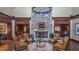 Inviting lobby with a stone fireplace, comfortable seating, and stylish chandelier at 1637 Hasentree Villa Ln, Wake Forest, NC 27587