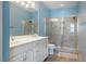 Bright bathroom with a dual vanity, glass shower enclosure and natural light at 211 Monarda Way, Hillsborough, NC 27278