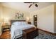 Comfortable bedroom featuring a ceiling fan, area rug and bright natural light at 211 Monarda Way, Hillsborough, NC 27278