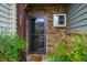 Charming front entrance with stone accents and neat landscaping at 211 Monarda Way, Hillsborough, NC 27278