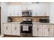Gourmet kitchen with stainless steel appliances and ample counter space at 211 Monarda Way, Hillsborough, NC 27278