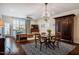 Open-concept living and dining area featuring hardwood floors and natural light at 211 Monarda Way, Hillsborough, NC 27278