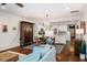 Open-concept space with a combined living, dining, and kitchen area featuring hardwood floors and neutral decor at 211 Monarda Way, Hillsborough, NC 27278