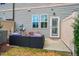 Cozy patio area with outdoor seating, perfect for relaxing and enjoying the fresh air at 211 Monarda Way, Hillsborough, NC 27278