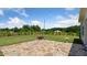 View of home's backyard features patio, landscaping, and generous lawn space at 217 Walker Grv Ln, Lillington, NC 27546