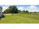 An expansive backyard featuring a well-maintained lawn and landscaping at 217 Walker Grv Ln, Lillington, NC 27546