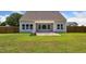 The backyard features a patio, landscaping and generous green space at 217 Walker Grv Ln, Lillington, NC 27546