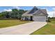 Beautiful home featuring a well-manicured lawn and a spacious two-car garage at 217 Walker Grv Ln, Lillington, NC 27546