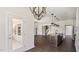 Open floor plan, from the kitchen to the living room with stairs to the second floor at 217 Walker Grv Ln, Lillington, NC 27546