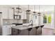 Stylish kitchen featuring a granite island, chic pendant lights, and stainless steel appliances at 217 Walker Grv Ln, Lillington, NC 27546
