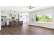 Open kitchen with stainless steel appliances, large island, and hardwood floors at 217 Walker Grv Ln, Lillington, NC 27546