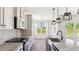 Gourmet kitchen showcasing a granite island, modern appliances, and ample counter space at 217 Walker Grv Ln, Lillington, NC 27546