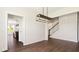 Open living area with hardwood floors and stairs that lead to the second floor at 217 Walker Grv Ln, Lillington, NC 27546
