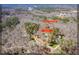 Stunning aerial view of a wooded property featuring a beautiful home and lush greenery at 2309 Laurelford Ln, Wake Forest, NC 27587
