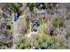 Aerial view showcasing property's location, surrounded by lush trees, and winding driveway at 2309 Laurelford Ln, Wake Forest, NC 27587