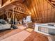 Unfinished attic space ready for renovation or storage featuring plywood floor and angled roof at 2309 Laurelford Ln, Wake Forest, NC 27587
