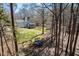 Aerial view of the spacious backyard, the home, play set, and trampoline at 2309 Laurelford Ln, Wake Forest, NC 27587