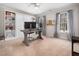 Cozy bedroom featuring a pull-down bed, a built-in bookcase, carpeted floor and natural light at 2309 Laurelford Ln, Wake Forest, NC 27587