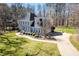 Charming two-story home with a landscaped yard and a welcoming blue front door at 2309 Laurelford Ln, Wake Forest, NC 27587